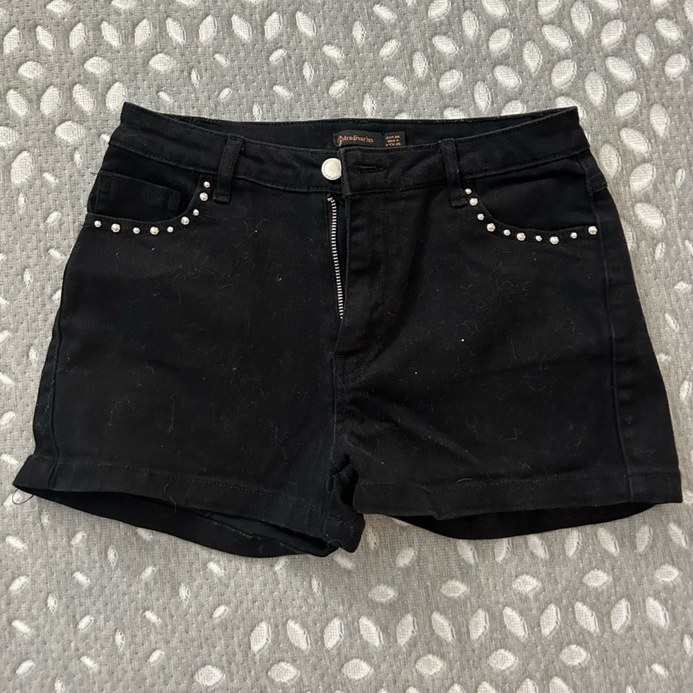 Black Jean shorts with silver studs on the pockets. Size 4